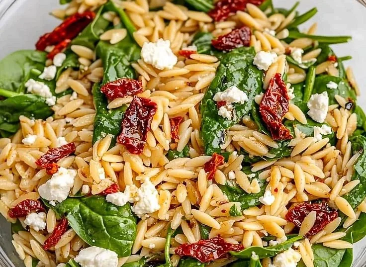 Balsamic Orzo Salad with fresh vegetables and dressing.