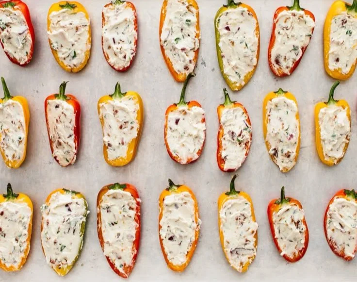 Delicious stuffed mini peppers filled with cheese and herbs, perfect for appetizers.