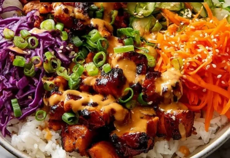 Delicious Korean BBQ chicken bowls served with fresh vegetables and rice