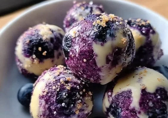 Blueberry Cheesecake Protein Bites with fresh blueberries and creamy texture