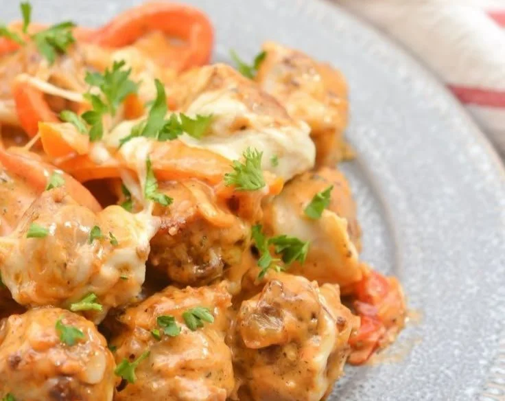 Cheesy keto sausage and peppers dish served in a bowl
