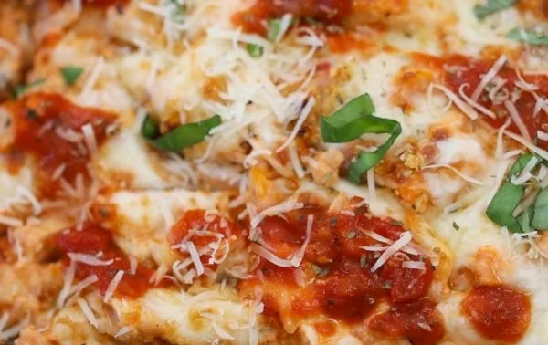 Deliciously baked Chicken Parm Casserole topped with melted cheese