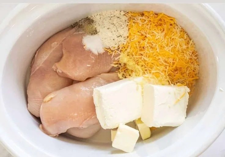 Delicious bowl of Crack Chicken with creamy sauce and herbs