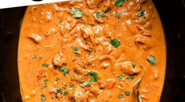 Delicious Crockpot Butter Chicken served with rice and herbs