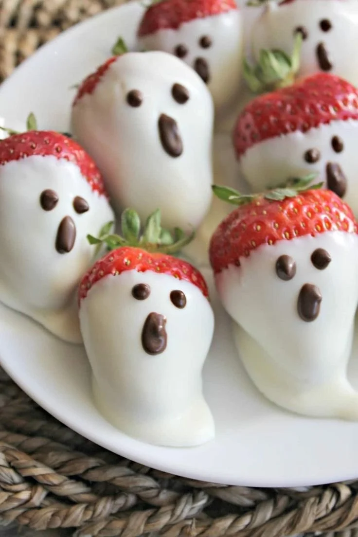 A variety of delicious Halloween treats, including spooky cupcakes and candy corn.