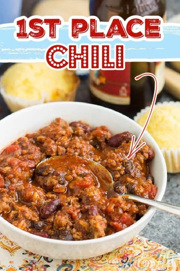 Bowl of first place chili with toppings, showcasing award-winning flavors.