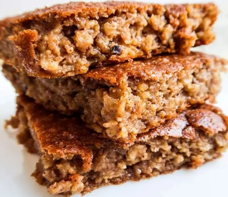 Gluten-free apple and pear spice cake served on a rustic wooden table