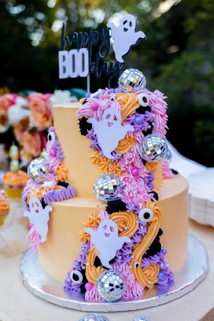 Halloween birthday party with spooky decorations and a festive Halloween cake