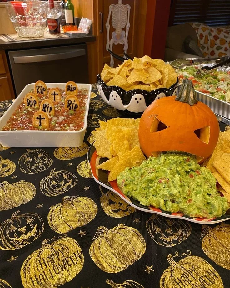 A variety of colorful Halloween treats including spooky cookies and candies.