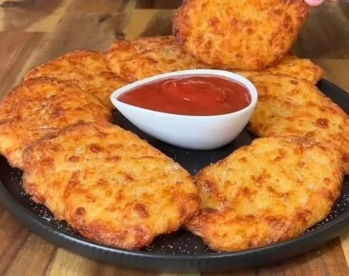 Plate of healthy low-calorie hash browns with fresh herbs