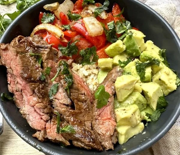 High protein steak fajita bowl with vibrant veggies and spices