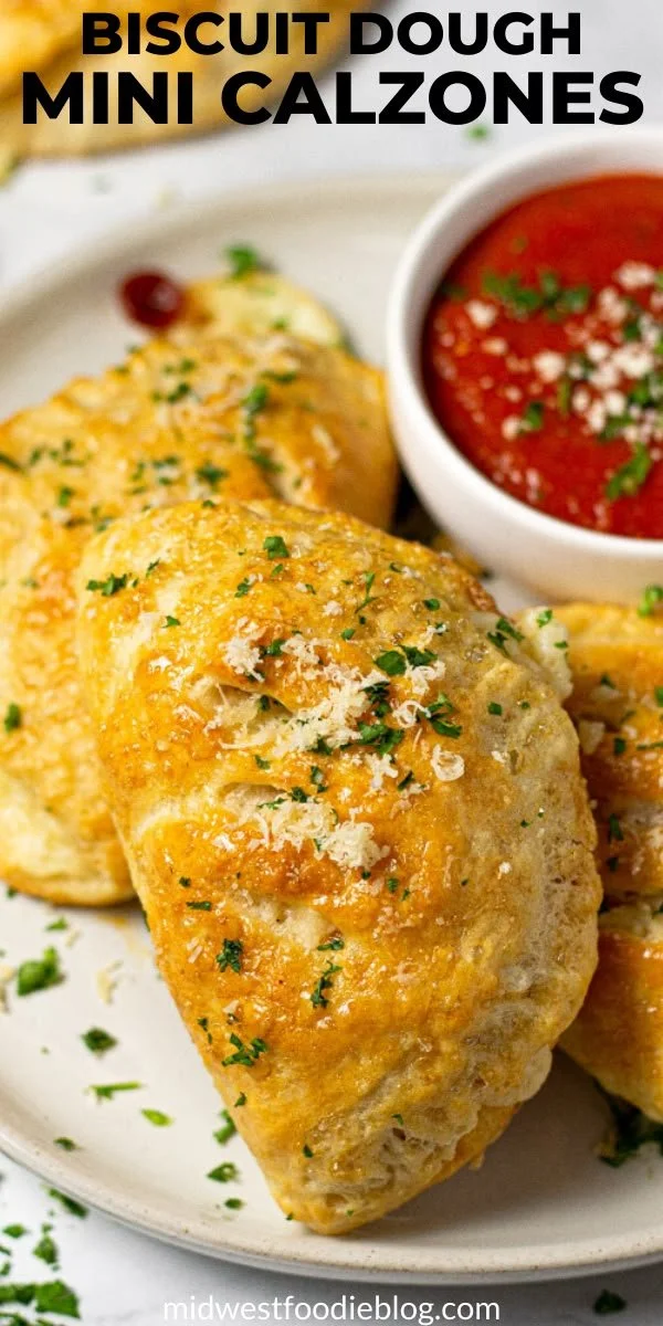 Mini Pepperoni Calzones made with biscuit dough, served on a plate.