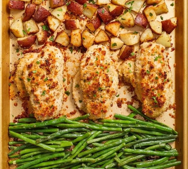 Delicious Parmesan Crusted Chicken on a sheet pan with veggies