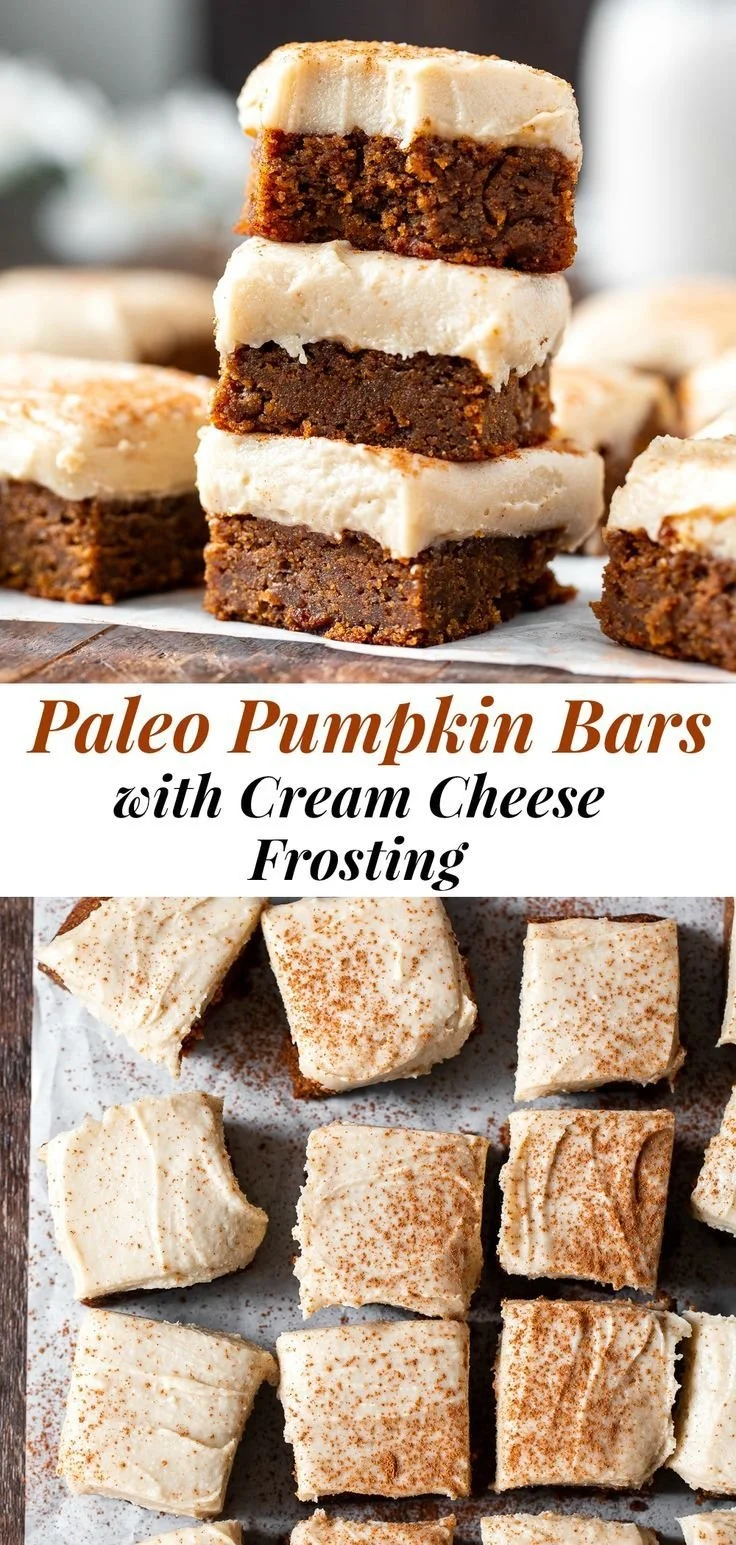 Delicious Paleo pumpkin bars with cream cheese frosting on a rustic wooden table