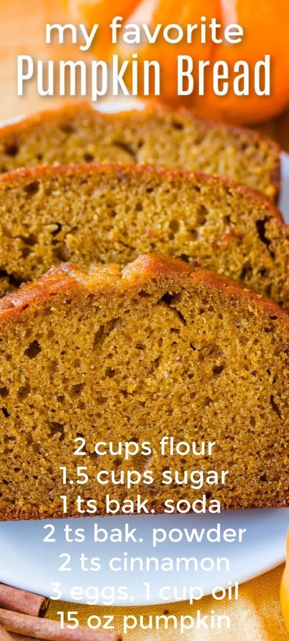 Easy pumpkin bread fresh out of the oven, topped with pumpkin seeds.