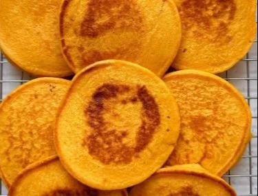 Delicious pumpkin cottage cheese pancakes served with maple syrup