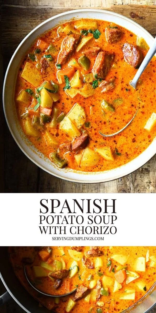 Bowl of Spanish Potato Soup with Chorizo and herbs on a wooden table