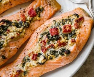 Stuffed salmon fillets with spinach and feta cheese on a plate