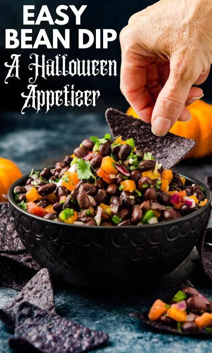 Delicious bean dip served in a bowl at a Halloween party for adults