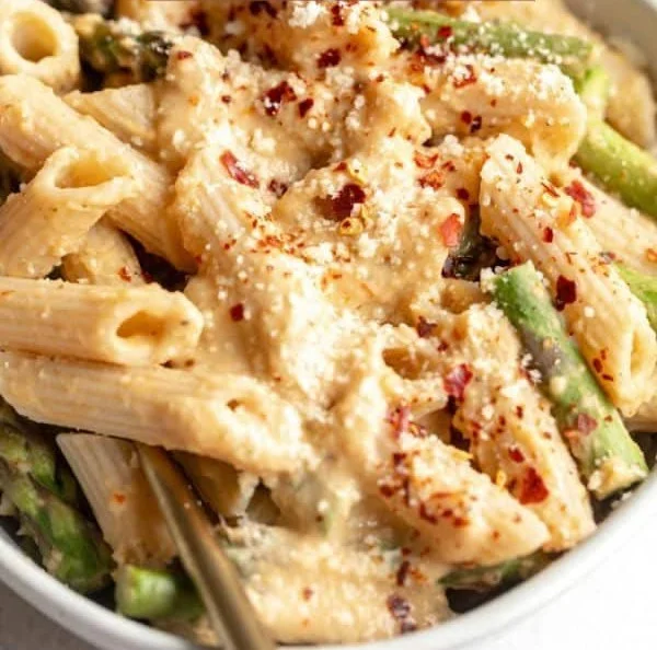 Delicious Vegan Lemon White Bean Pasta served with fresh herbs and lemon zest.