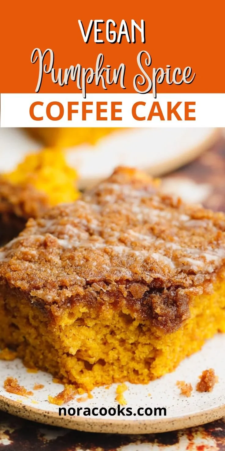Vegan Pumpkin Spice Coffee Cake topped with cinnamon and nuts on a wooden table.