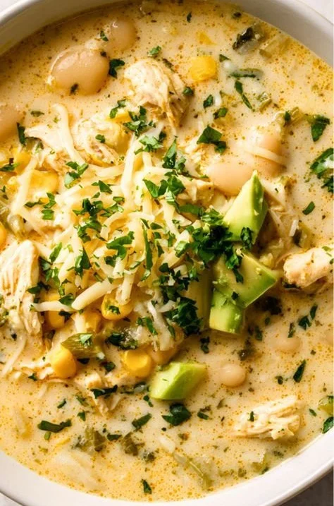 A bowl of white chicken chili topped with cilantro and lime at Wasian Cookery