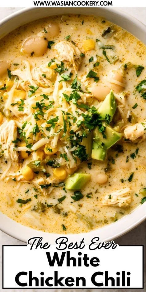 Creamy white chicken chili in a bowl garnished with cilantro and lime.