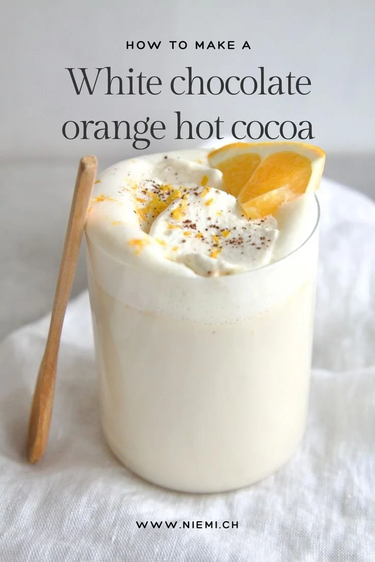 Delicious white chocolate orange hot cocoa served in a cozy mug