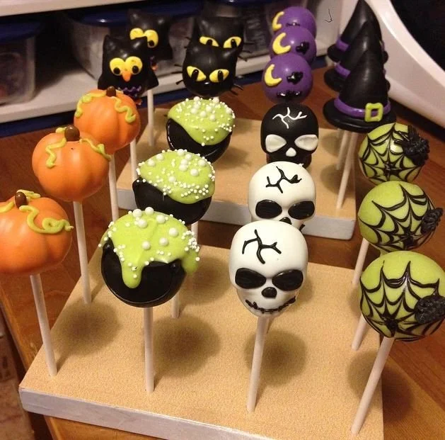 Delicious Halloween cake pops decorated with spooky designs and colors