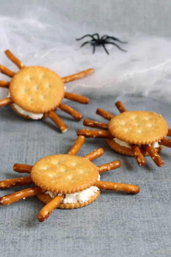 Cracker spiders: healthy Halloween treats for kids with less sugar.
