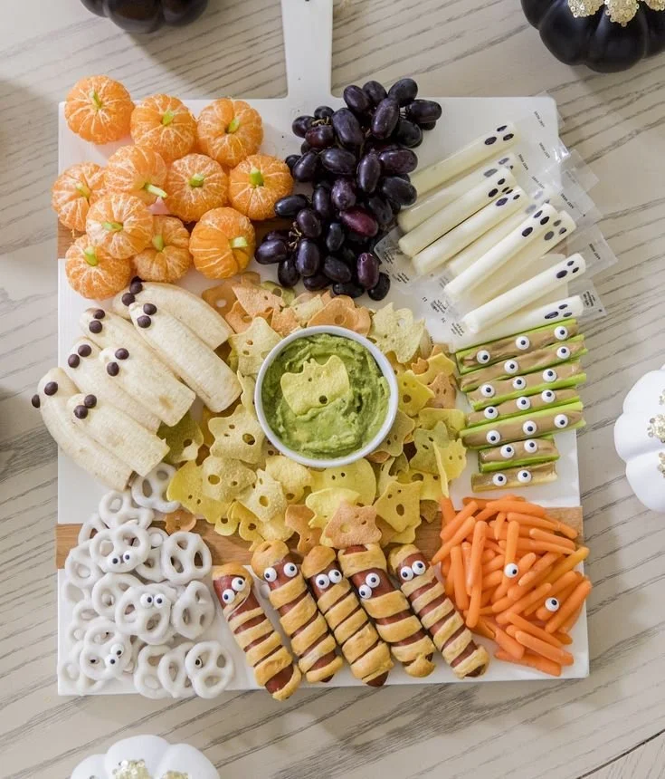Elegant Halloween dinner party setup with themed decor and delicious food