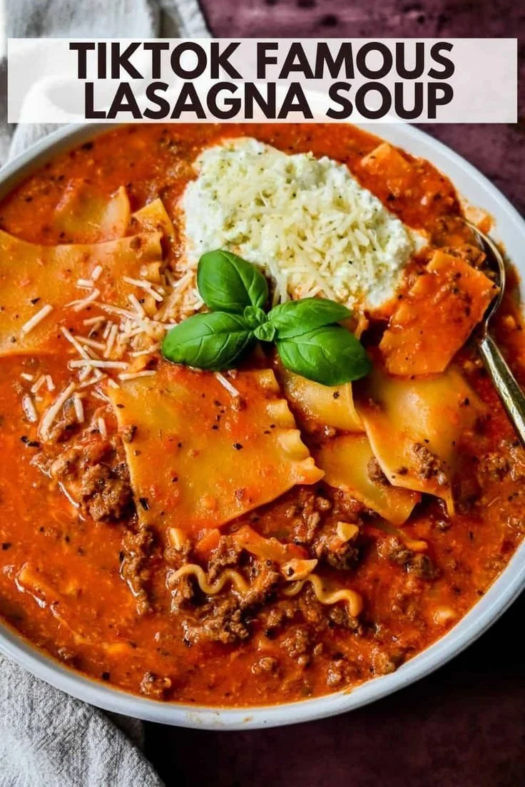 Delicious lasagna soup served in a bowl with fresh herbs on top