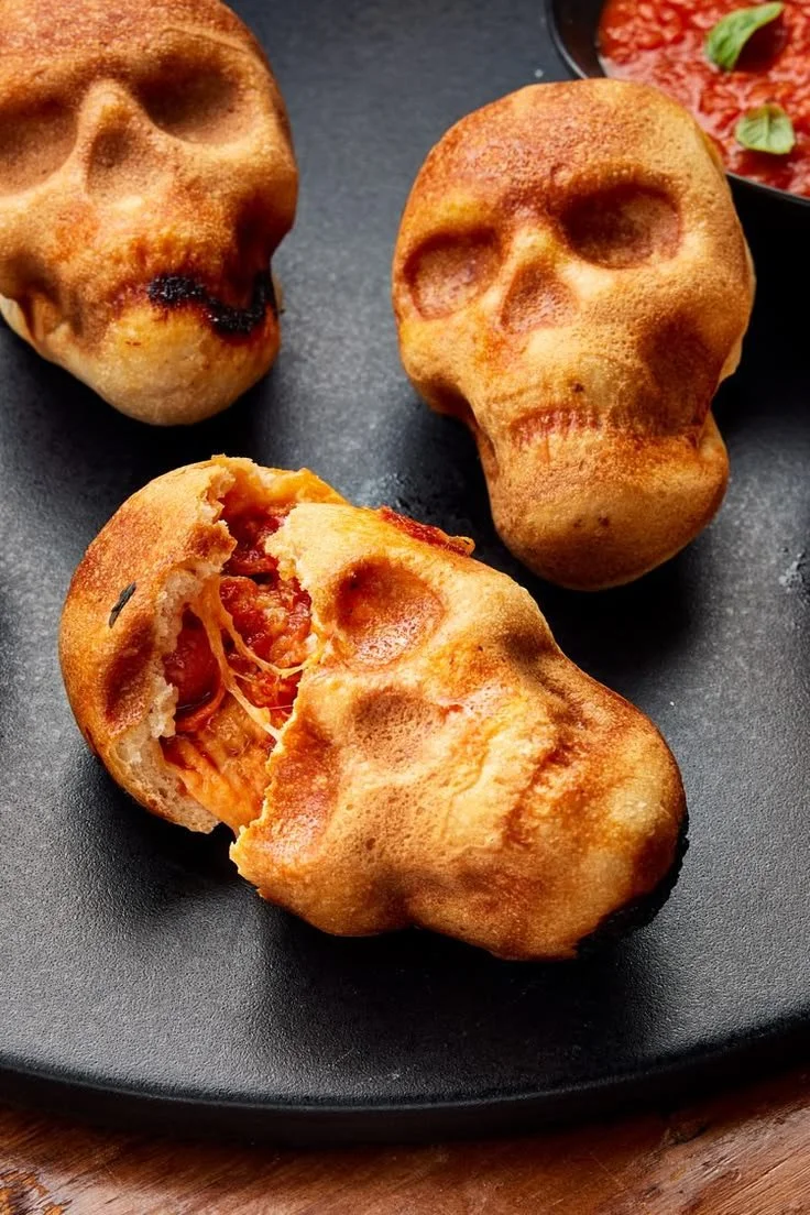 Delicious pizza skulls, a spooky Halloween snack for festive gatherings.