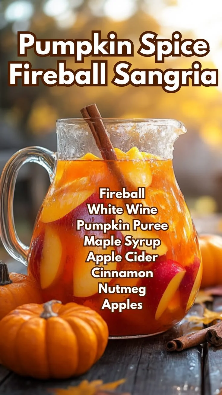 Glass of Pumpkin Spice Fireball Sangria garnished with cinnamon sticks and orange slices