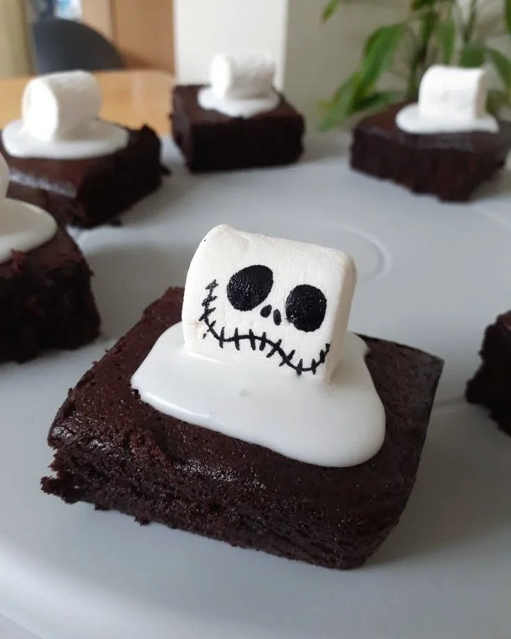 Halloween-themed spooky brownies decorated with spooky faces