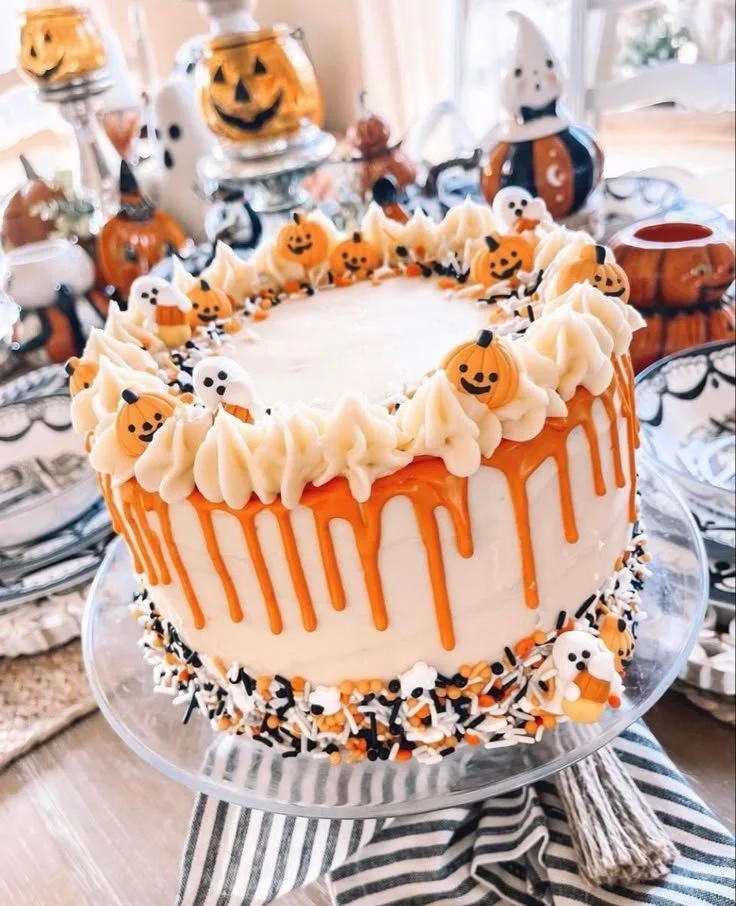 Spooky Halloween cake with orange frosting and drip decoration for festive celebrations.