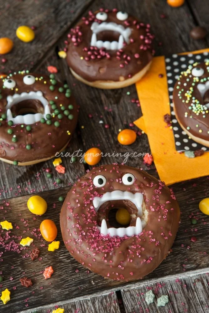 Vampire Halloween donuts decorated with spooky icing and candy fangs